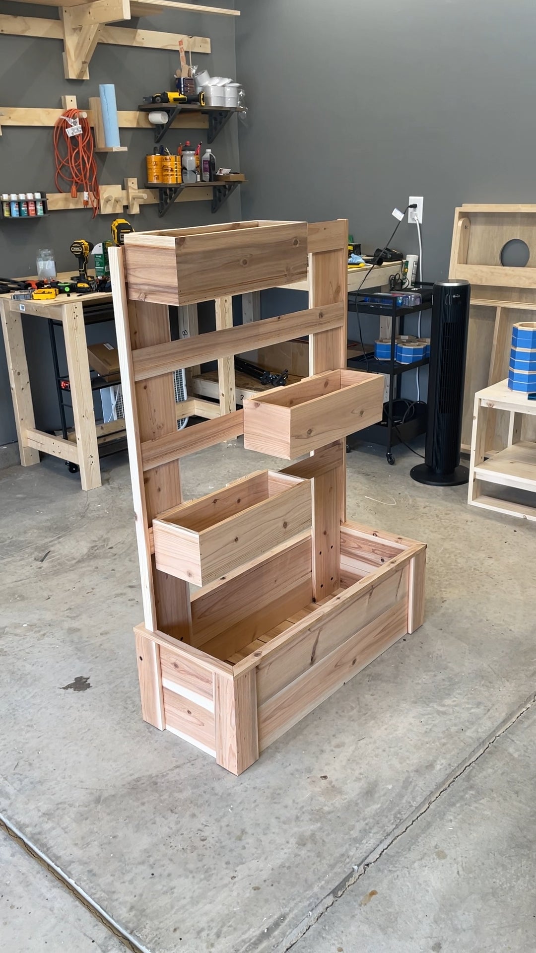 Completed French cleat modular planter build with tiered movable planter boxes, made from cedar